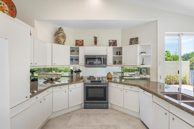 23193 Via Stel, Boca Raton, FL 33433 - kitchen featuring open shelves, stainless steel appliances, dark stone countertops, light tile patterned flooring, and white cabinets