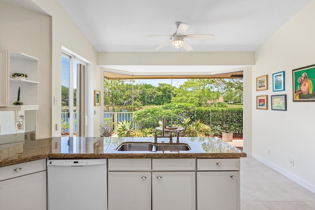23193 Via Stel, Boca Raton, FL 33433 - kitchen with dishwasher, a sink, white cabinets, a ceiling fan, and light tile patterned floors