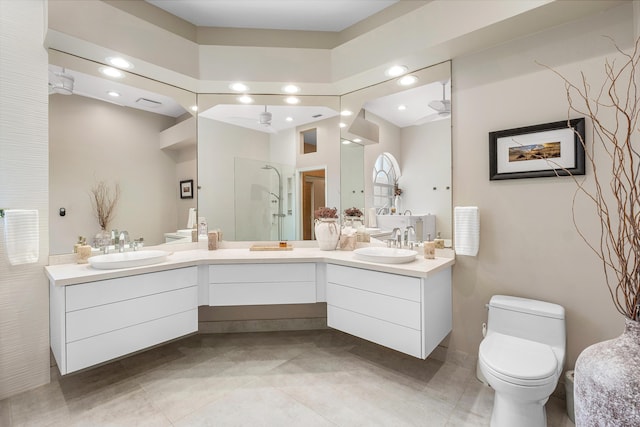 23193 Via Stel, Boca Raton, FL 33433 - bathroom with double vanity, walk in shower, toilet, recessed lighting, and ceiling fan