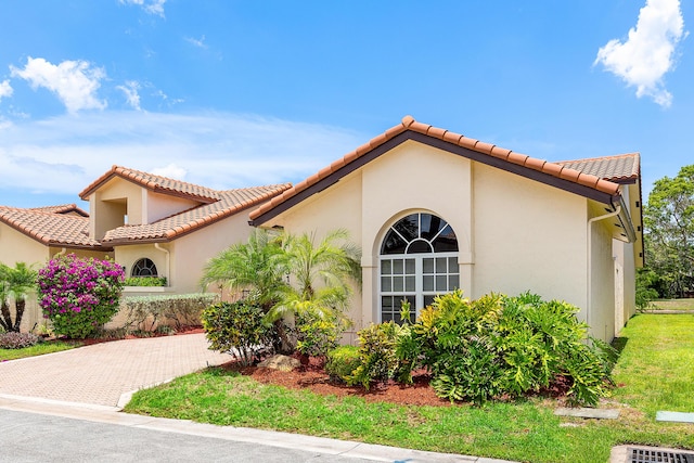 23193 Via Stel, Boca Raton, FL 33433 - view of front facade with stucco siding and a tiled roof