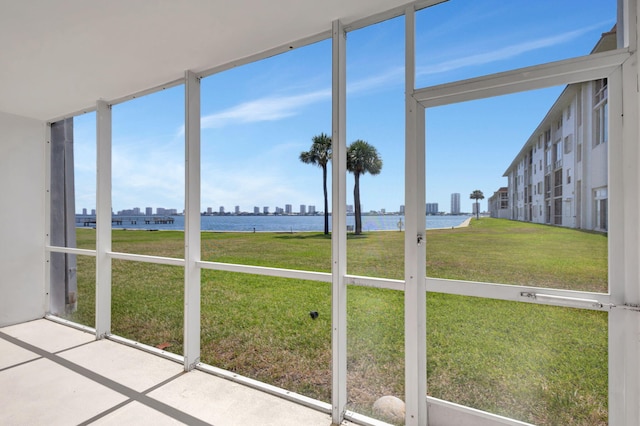 2936 Lake Shore Dr Unit 108, Riviera Beach, FL 33404 - unfurnished sunroom with a water view and a skyline view