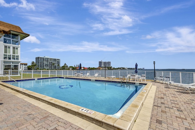 2936 Lake Shore Dr Unit 108, Riviera Beach, FL 33404 - community pool featuring a patio area