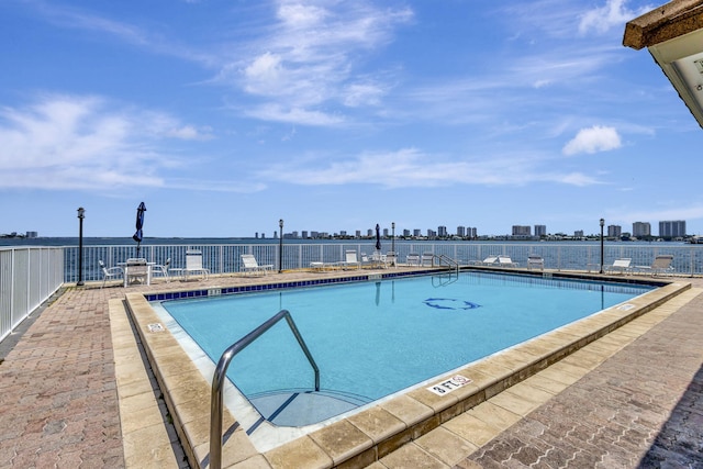 2936 Lake Shore Dr Unit 108, Riviera Beach, FL 33404 - community pool featuring a view of skyline and a patio area
