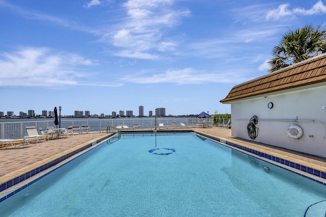 2936 Lake Shore Dr Unit 108, Riviera Beach, FL 33404 - community pool featuring a patio and a view of skyline