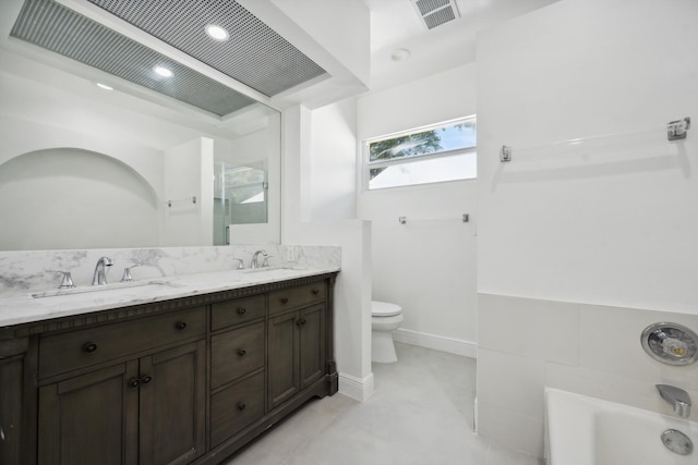 811 Hunter St, West Palm Beach, FL 33405 - bathroom featuring toilet, double vanity, a bathtub, and tile patterned flooring