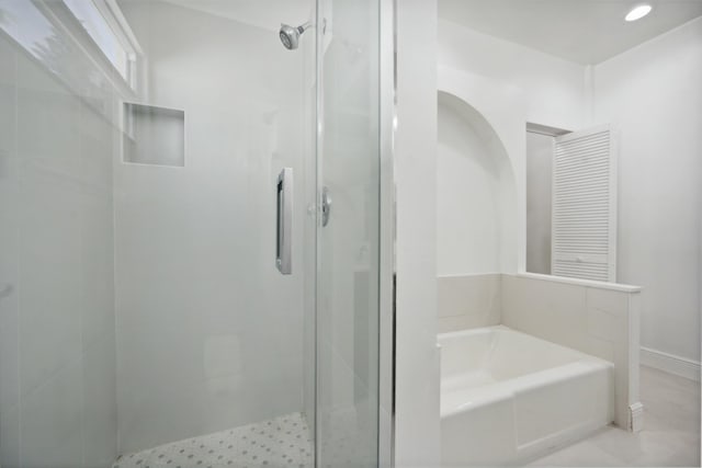 811 Hunter St, West Palm Beach, FL 33405 - bathroom featuring a stall shower and a garden tub