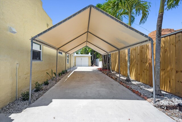 811 Hunter St, West Palm Beach, FL 33405 - view of parking / parking lot featuring a garage and a detached carport