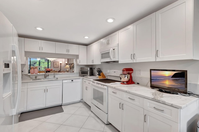 15075 Witney Rd Unit 212, Delray Beach, FL 33484 - kitchen featuring white appliances, a sink, white cabinetry, light tile patterned floors, and recessed lighting