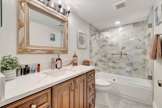 15075 Witney Rd Unit 212, Delray Beach, FL 33484 - bathroom featuring vanity, toilet, combined bath / shower with glass door, and tile patterned floors