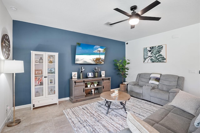 2431 Crowned Eagle Cir SW, Vero Beach, FL 32962 - living room featuring a ceiling fan, baseboards, and light tile patterned floors