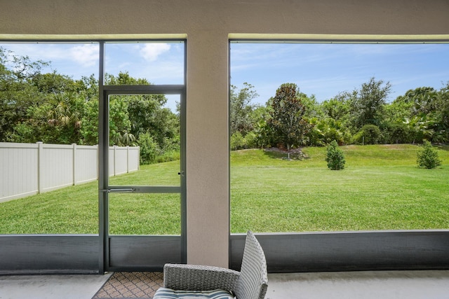 2431 Crowned Eagle Cir SW, Vero Beach, FL 32962 - doorway featuring view of scattered trees