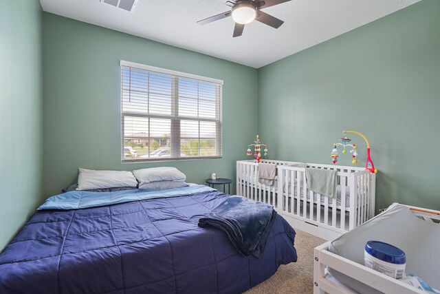 2431 Crowned Eagle Cir SW, Vero Beach, FL 32962 - carpeted bedroom with ceiling fan