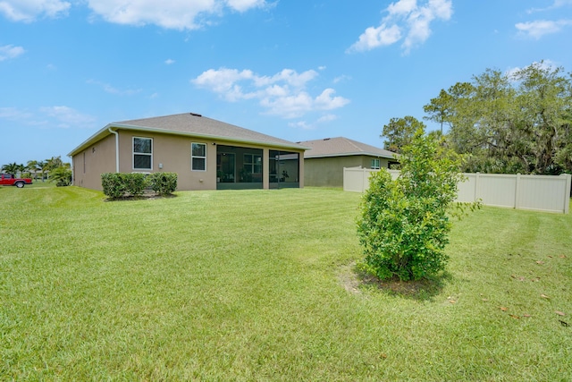 2431 Crowned Eagle Cir SW, Vero Beach, FL 32962 - back of property with a sunroom and stucco siding