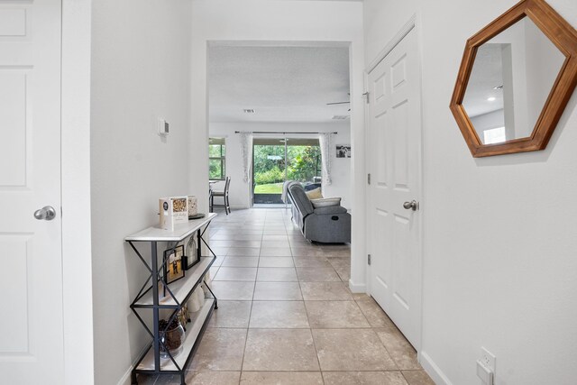 2431 Crowned Eagle Cir SW, Vero Beach, FL 32962 - hall featuring baseboards and light tile patterned floors