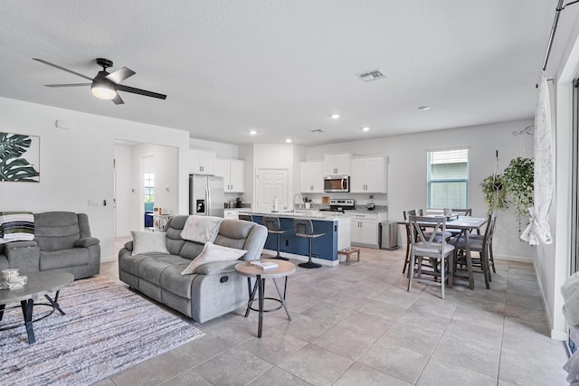 2431 Crowned Eagle Cir SW, Vero Beach, FL 32962 - living area with ceiling fan, recessed lighting, and baseboards