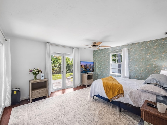 505 Palmetto St, West Palm Beach, FL 33405 - bedroom with access to exterior, wood finished floors, multiple windows, and wallpapered walls