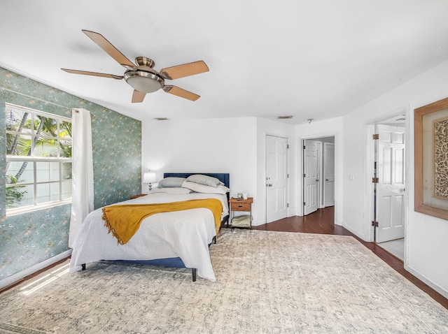 505 Palmetto St, West Palm Beach, FL 33405 - bedroom with a ceiling fan, wood finished floors, and baseboards