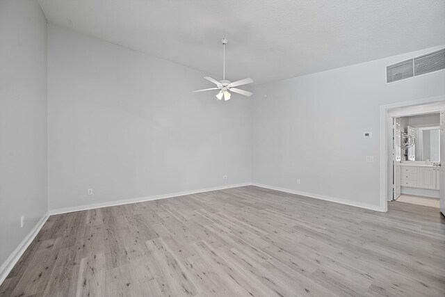 10834 SW Dardanelle Dr, Port Saint Lucie, FL 34987 - unfurnished room with light wood-style flooring, a ceiling fan, and baseboards