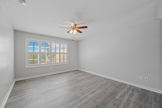 10834 SW Dardanelle Dr, Port Saint Lucie, FL 34987 - spare room with a ceiling fan, wood finished floors, a textured ceiling, and baseboards