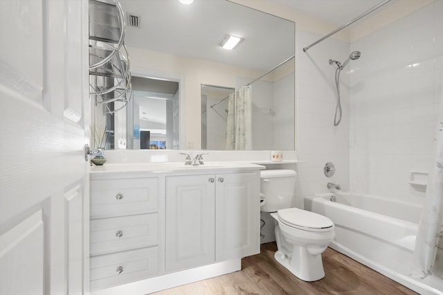 10834 SW Dardanelle Dr, Port Saint Lucie, FL 34987 - bathroom featuring shower / bath combo with shower curtain, toilet, vanity, and wood finished floors