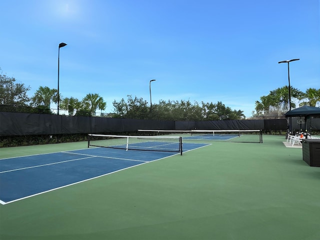 10834 SW Dardanelle Dr, Port Saint Lucie, FL 34987 - view of tennis court featuring community basketball court