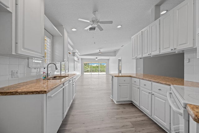 10834 SW Dardanelle Dr, Port Saint Lucie, FL 34987 - kitchen featuring a sink, ceiling fan, lofted ceiling, white cabinets, and white appliances