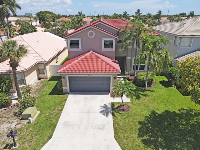 3559 Hudson Ln, Boynton Beach, FL 33436 - mediterranean / spanish-style home with a tiled roof, stucco siding, driveway, an attached garage, and a front yard