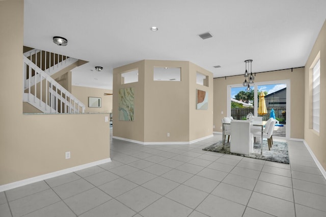 3559 Hudson Ln, Boynton Beach, FL 33436 - unfurnished dining area featuring light tile patterned floors, stairway, a chandelier, and recessed lighting