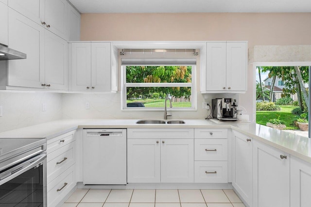 6321 Lansdowne Cir, Boynton Beach, FL 33472 - kitchen featuring dishwashing machine, a sink, backsplash, and electric stove