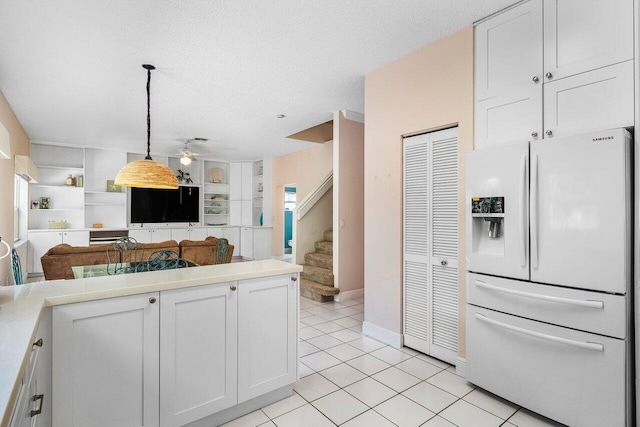 6321 Lansdowne Cir, Boynton Beach, FL 33472 - kitchen featuring white fridge with ice dispenser, open floor plan, light tile patterned floors, a ceiling fan, and light countertops