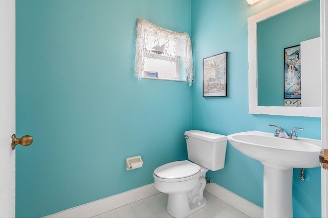 6321 Lansdowne Cir, Boynton Beach, FL 33472 - half bath with toilet, baseboards, and tile patterned floors