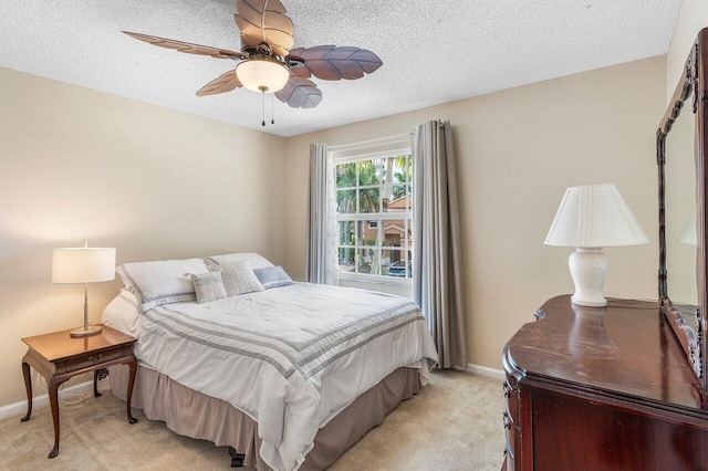 6321 Lansdowne Cir, Boynton Beach, FL 33472 - bedroom featuring light carpet, baseboards, a textured ceiling, and a ceiling fan