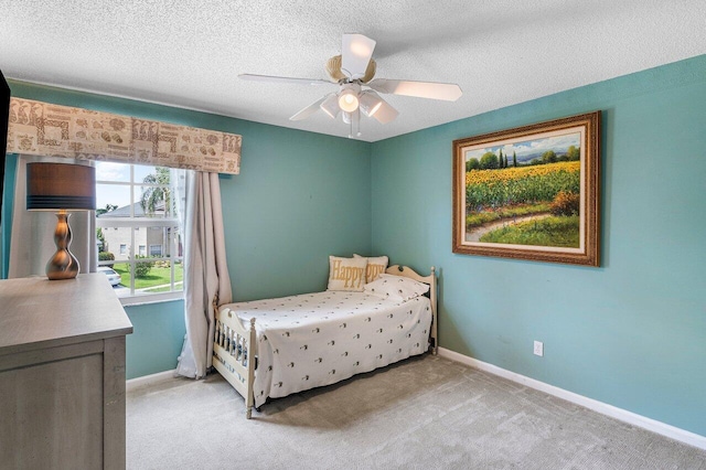 6321 Lansdowne Cir, Boynton Beach, FL 33472 - bedroom with baseboards, light colored carpet, ceiling fan, and a textured ceiling