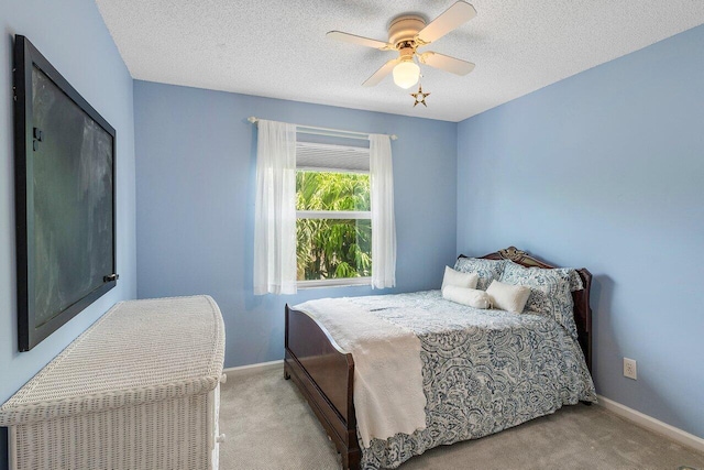 6321 Lansdowne Cir, Boynton Beach, FL 33472 - bedroom featuring carpet, baseboards, a textured ceiling, and ceiling fan
