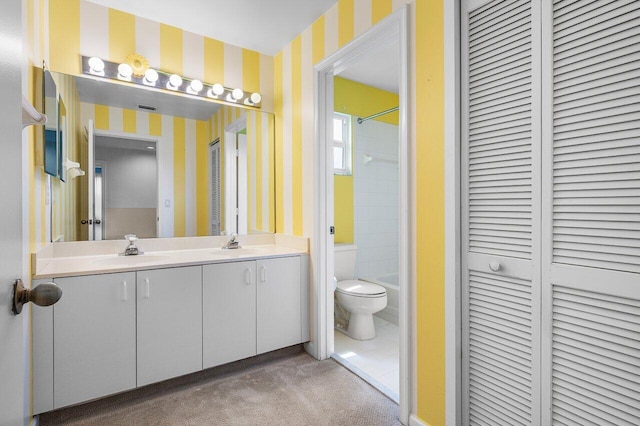 6321 Lansdowne Cir, Boynton Beach, FL 33472 - bathroom with a closet, wallpapered walls, double vanity, toilet, and shower / bathtub combination