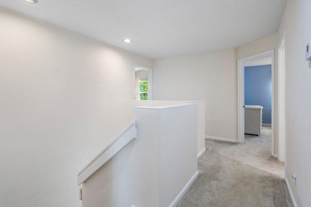 6321 Lansdowne Cir, Boynton Beach, FL 33472 - corridor with an upstairs landing, light colored carpet, recessed lighting, and baseboards