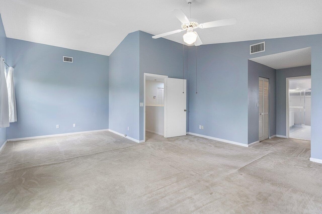 6321 Lansdowne Cir, Boynton Beach, FL 33472 - unfurnished bedroom with baseboards, carpet flooring, ensuite bathroom, a ceiling fan, and high vaulted ceiling