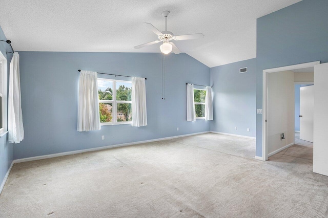 6321 Lansdowne Cir, Boynton Beach, FL 33472 - carpeted empty room with a ceiling fan, lofted ceiling, baseboards, and a textured ceiling