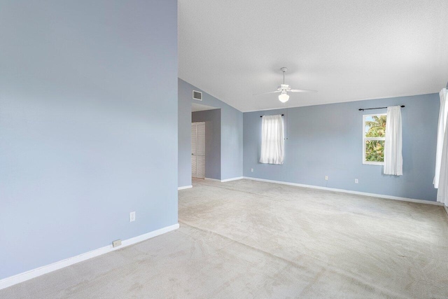 6321 Lansdowne Cir, Boynton Beach, FL 33472 - unfurnished room with ceiling fan, carpet flooring, baseboards, and vaulted ceiling