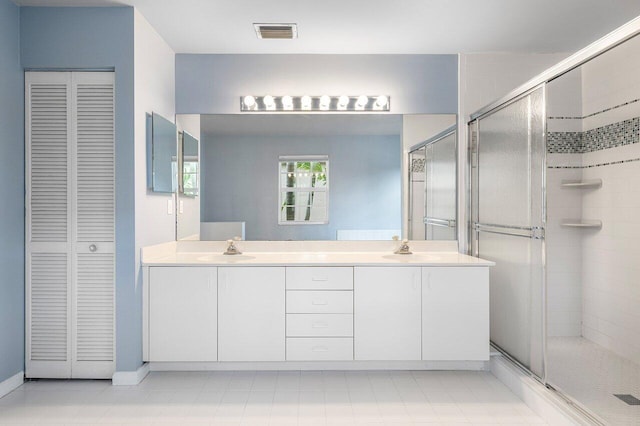 6321 Lansdowne Cir, Boynton Beach, FL 33472 - bathroom with a closet, double vanity, and a shower stall