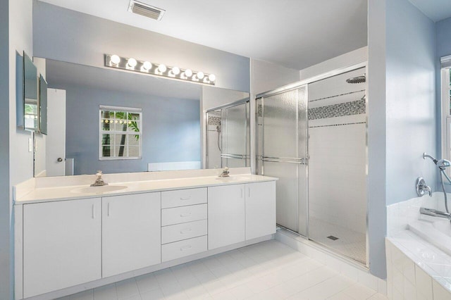 6321 Lansdowne Cir, Boynton Beach, FL 33472 - full bathroom featuring double vanity, a shower stall, tile patterned floors, and a bath