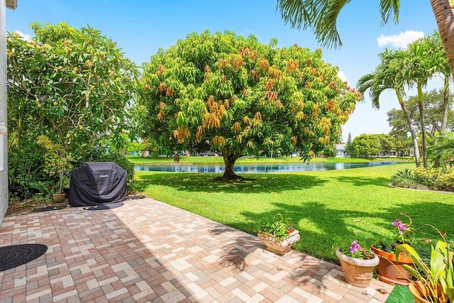 6321 Lansdowne Cir, Boynton Beach, FL 33472 - view of patio with a water view and grilling area