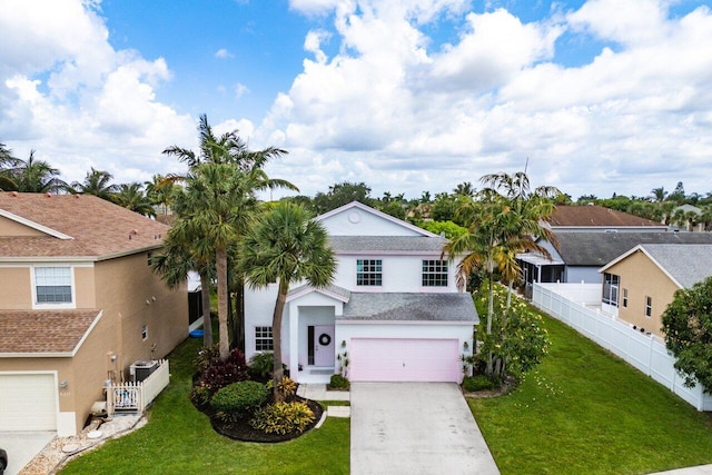 6321 Lansdowne Cir, Boynton Beach, FL 33472 - view of front of house featuring an attached garage, concrete driveway, and stucco siding