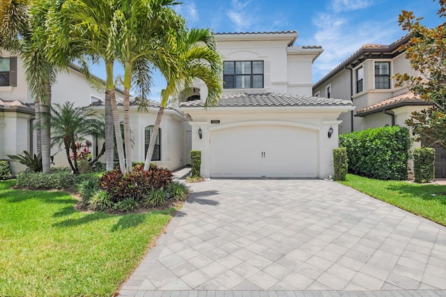 9350 Eden Roc Ct, Delray Beach, FL 33446 - mediterranean / spanish-style home featuring a tiled roof, decorative driveway, stucco siding, and a front yard