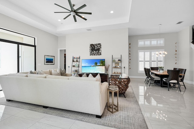 9350 Eden Roc Ct, Delray Beach, FL 33446 - living area with a chandelier, a ceiling fan, recessed lighting, a tray ceiling, and a towering ceiling