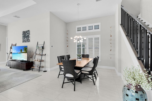 9350 Eden Roc Ct, Delray Beach, FL 33446 - dining area with stairway, a chandelier, baseboards, and a high ceiling