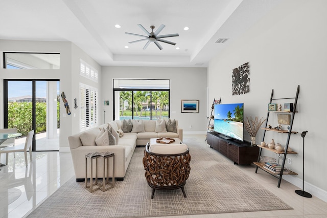 9350 Eden Roc Ct, Delray Beach, FL 33446 - living area featuring ceiling fan, recessed lighting, baseboards, a raised ceiling, and a towering ceiling