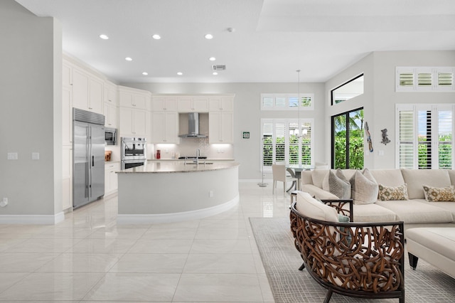 9350 Eden Roc Ct, Delray Beach, FL 33446 - living room with baseboards, recessed lighting, and a towering ceiling