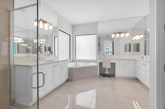 9350 Eden Roc Ct, Delray Beach, FL 33446 - bathroom with a garden tub, tile patterned floors, two vanities, and a shower stall