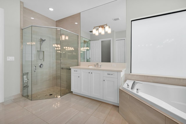 9350 Eden Roc Ct, Delray Beach, FL 33446 - full bathroom featuring vanity, a stall shower, a garden tub, and tile patterned floors